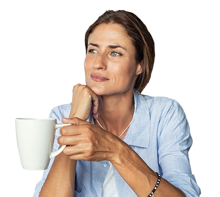 woman in kitchen with cup of espresso